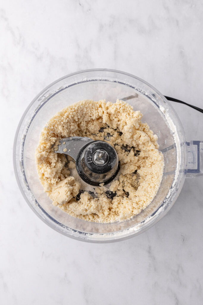 Shortbread cookie dough in a food processor.