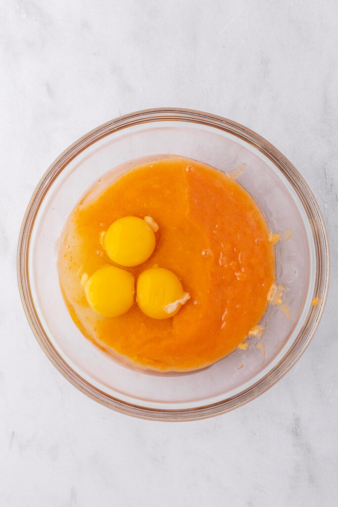 Papaya puree and eggs in a glass bowl.