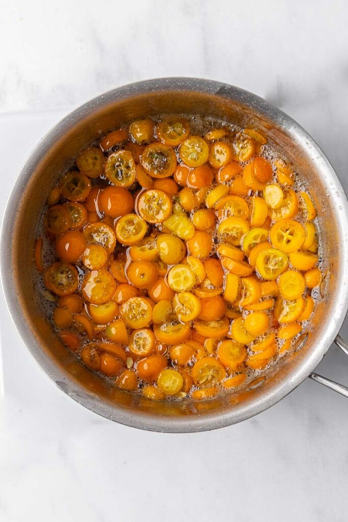 Candied kumquats in a pot.