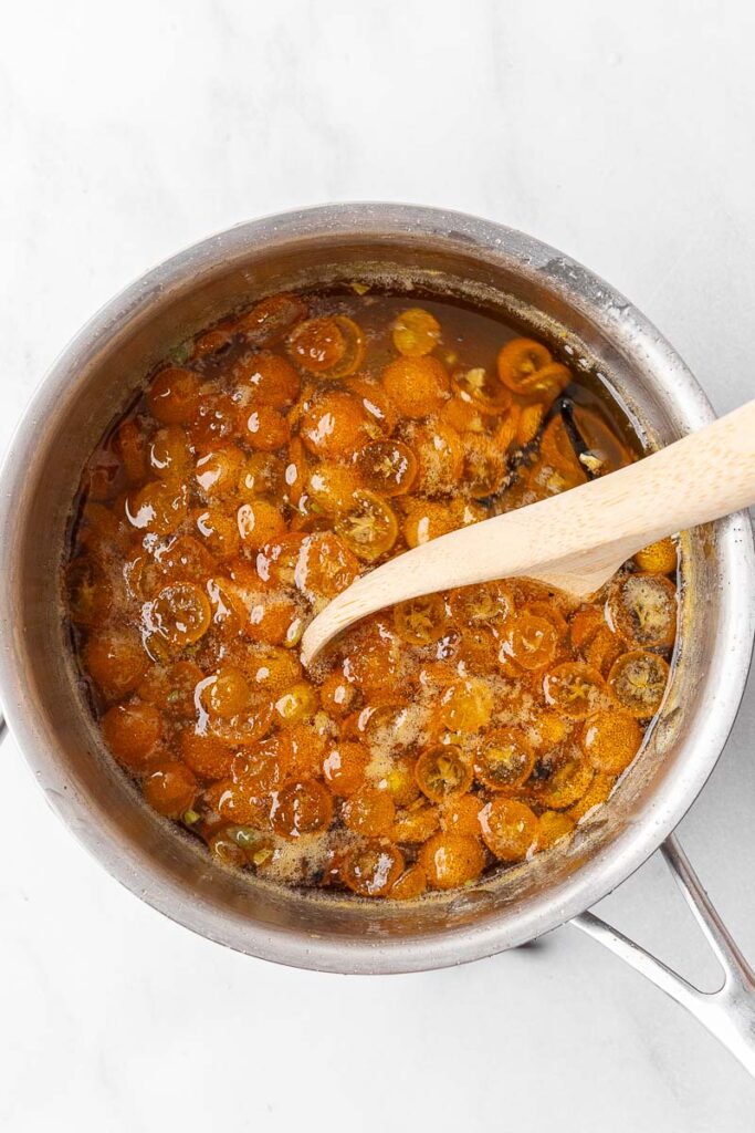 Candied kumquats in a pot.