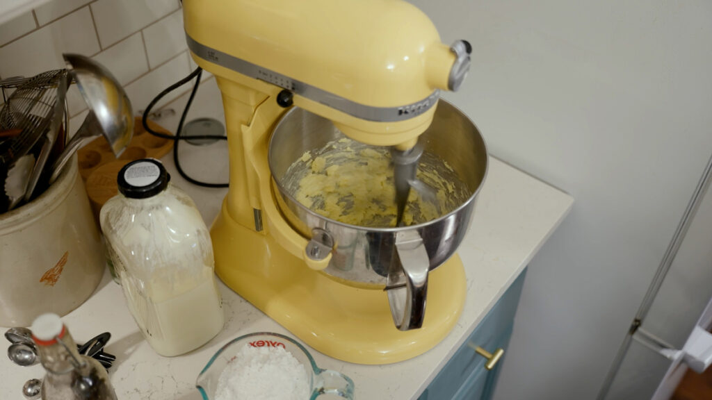 Butter being creamed in a stand mixer.