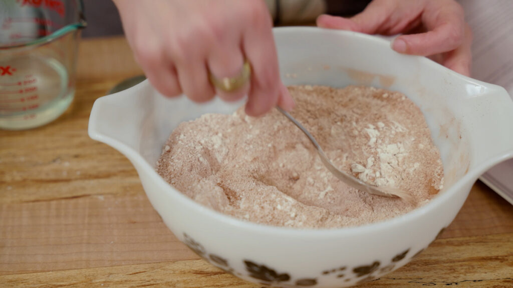 Dry ingredients for chocolate wacky cake in a bowl.