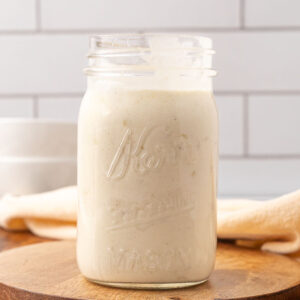 A Mason jar with gluten free cream of chicken soup in it.