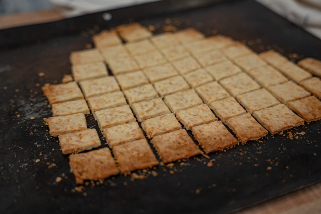 Homemade crackers on a cookie sheet.