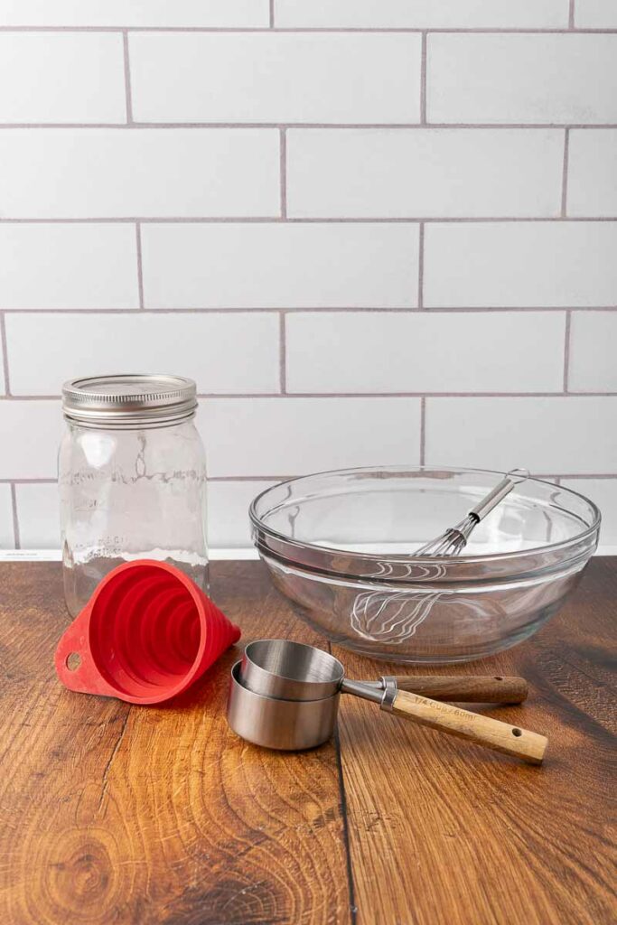 Supplies for making a no knead bread dough in a jar.