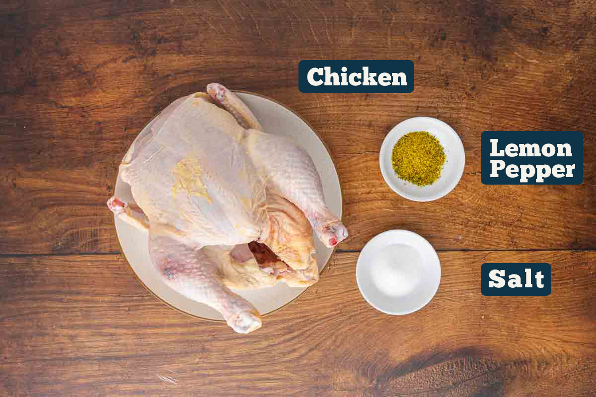 Oven roasted chicken ingredients: whole chicken, lemon pepper, and salt