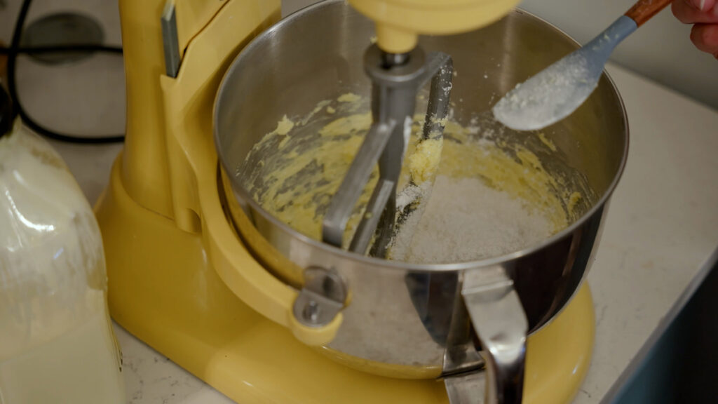 Ingredients for chocolate buttercream frosting in a stand mixer.