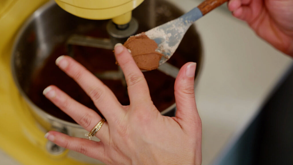 Chocolate frosting on a spatula.