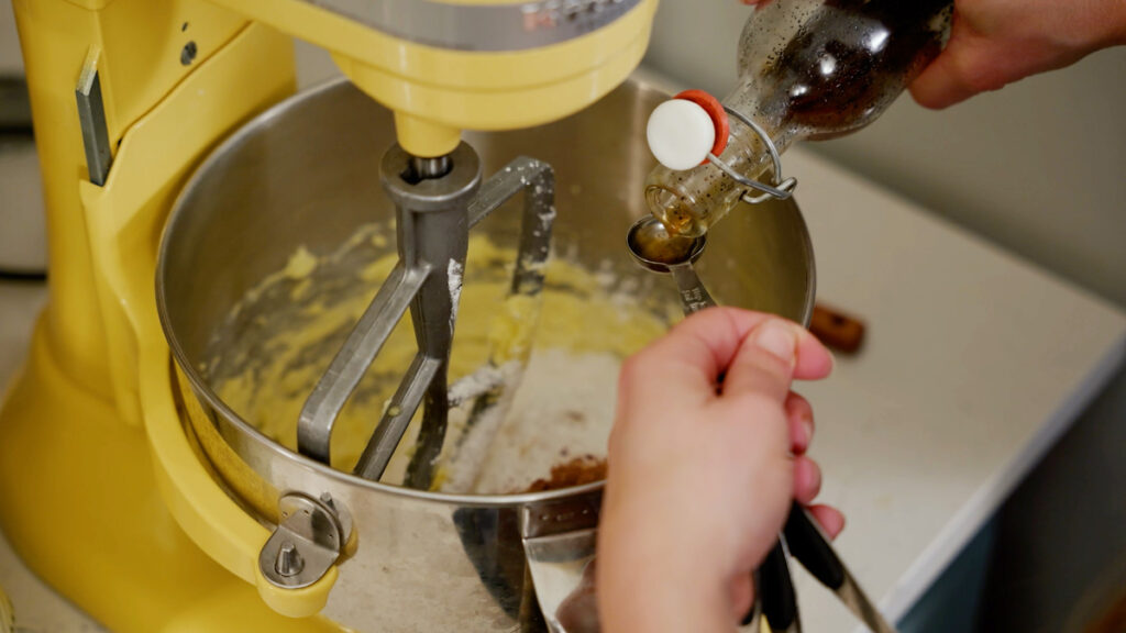 Ingredients for chocolate buttercream frosting in a stand mixer.