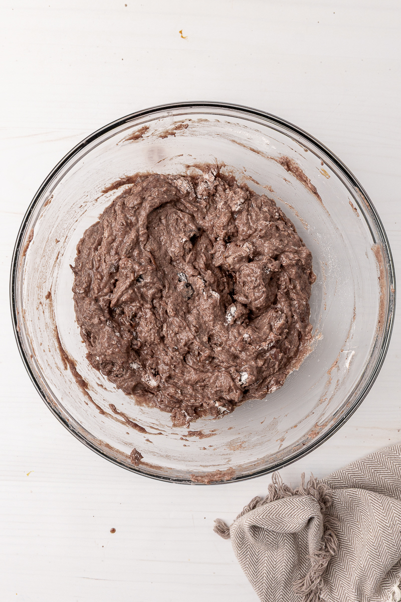 Date bread batter in a clear glass bowl.