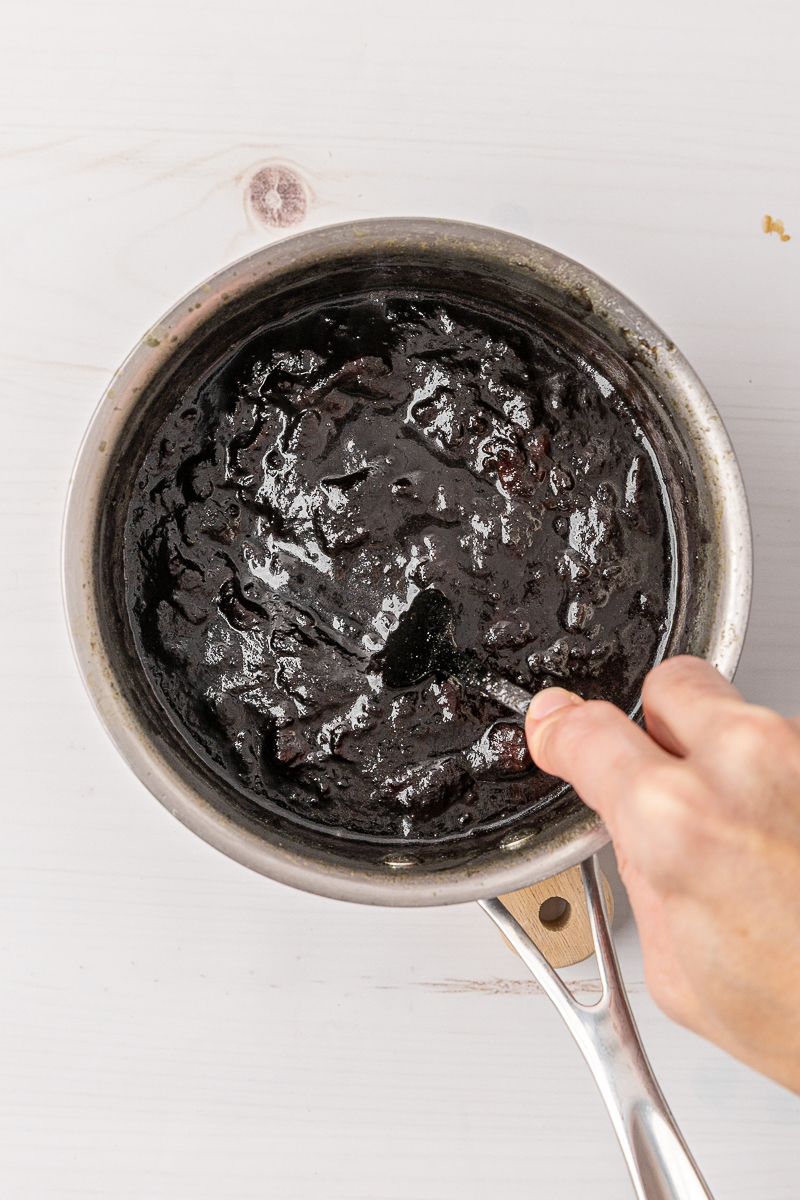 Cooked dates in a small sauce pan.