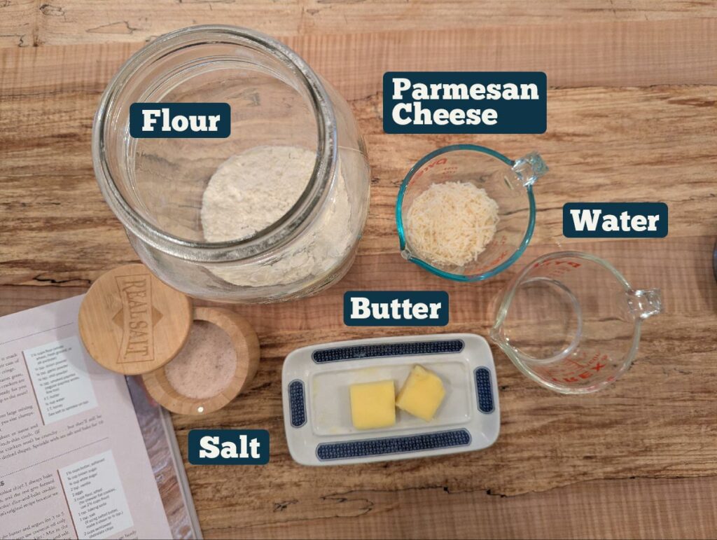 Ingredients to make homemade crackers on a wooden counter.