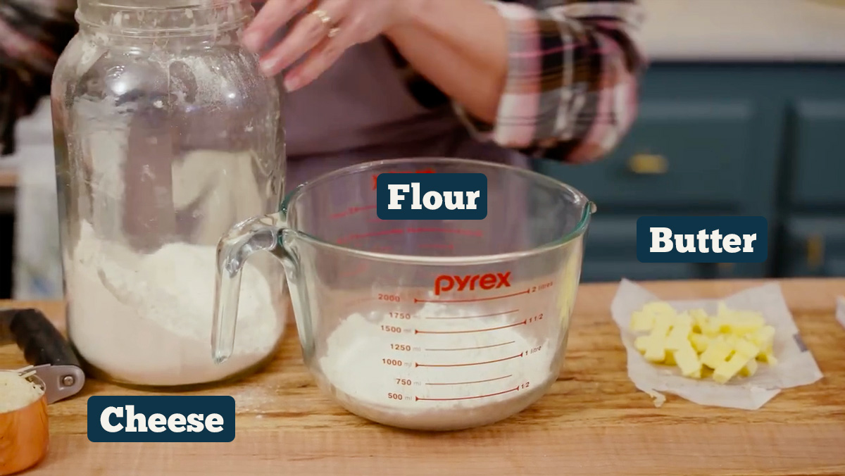 Homemade cheese cracker ingredients: cheese, flour, butter, and water.