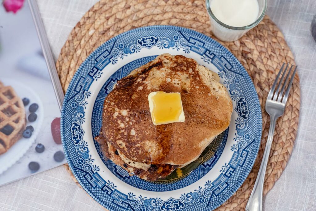 A stack of sourdough pancakes on a blue plate.