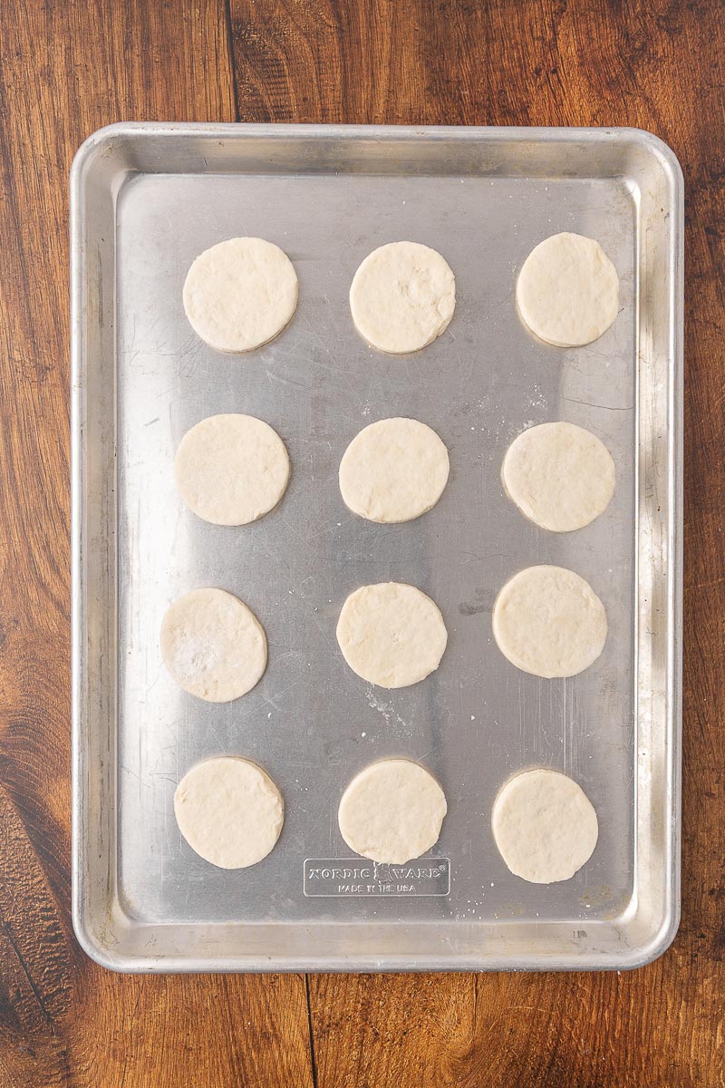 Unbaked biscuits on a baking tray.
