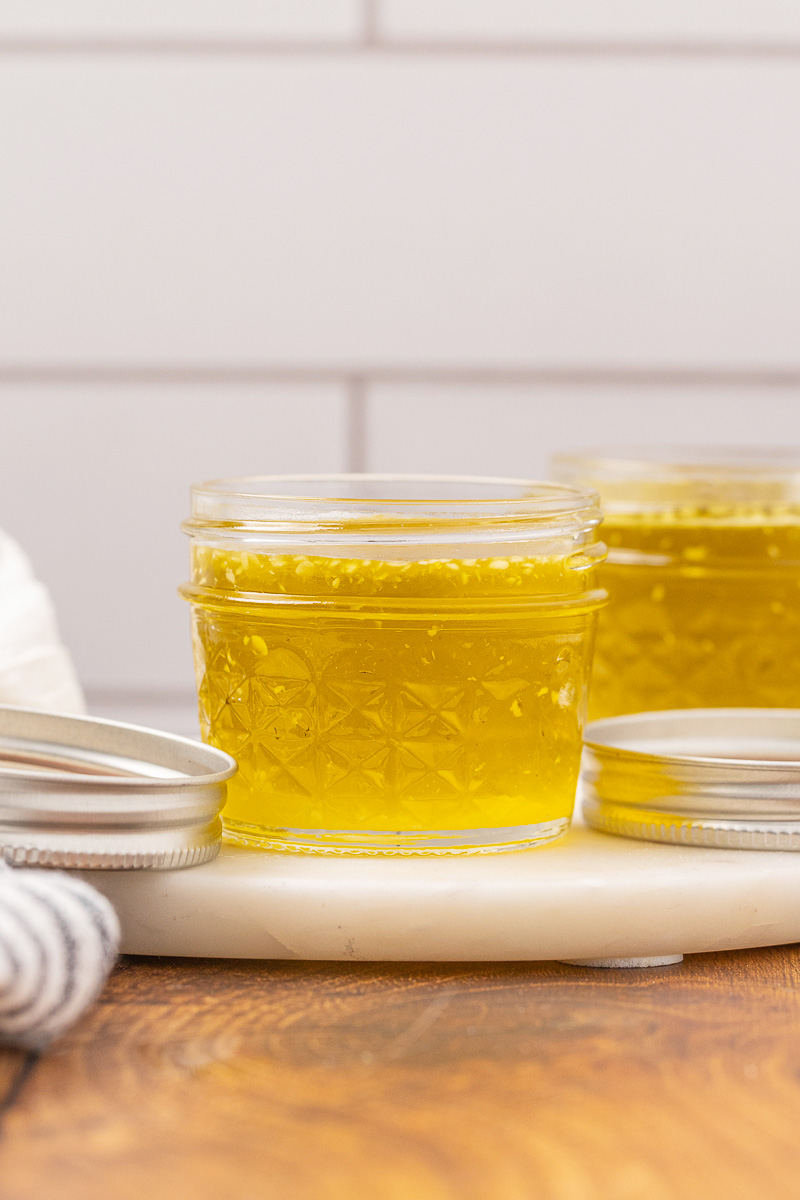 A glass jelly jar filled with herbal salve.