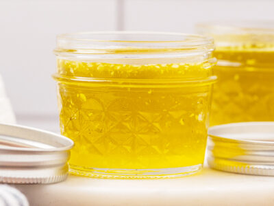 A jelly jar full of finished herbal salve.