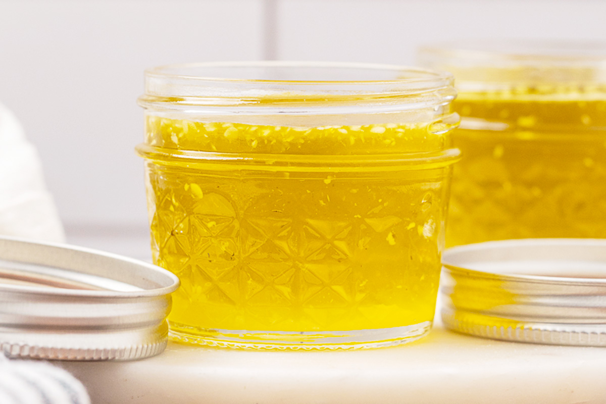 A jelly jar full of finished herbal salve.