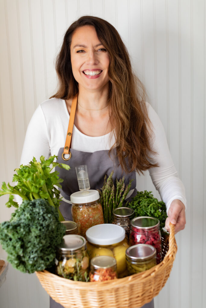 Woman holding a basket of preserved food