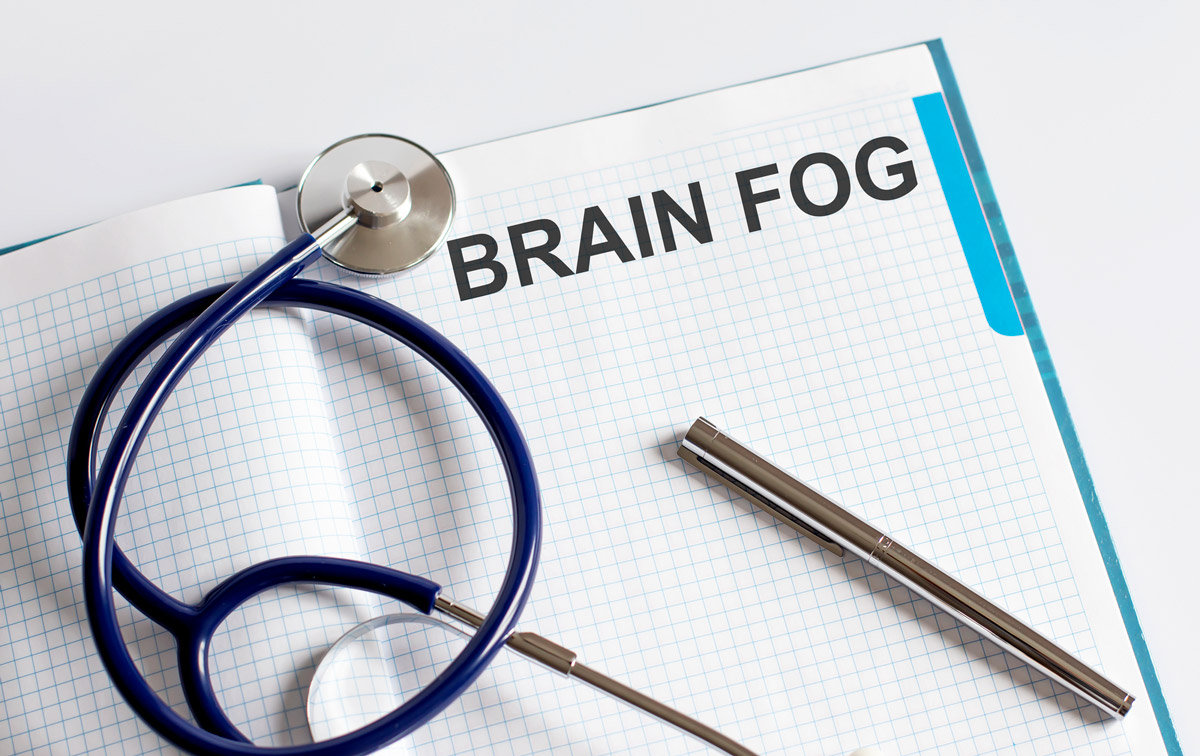 A notebook with "Brain Fog" written on it.