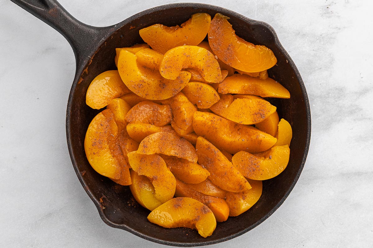 Peaches in a cast iron skillet.
