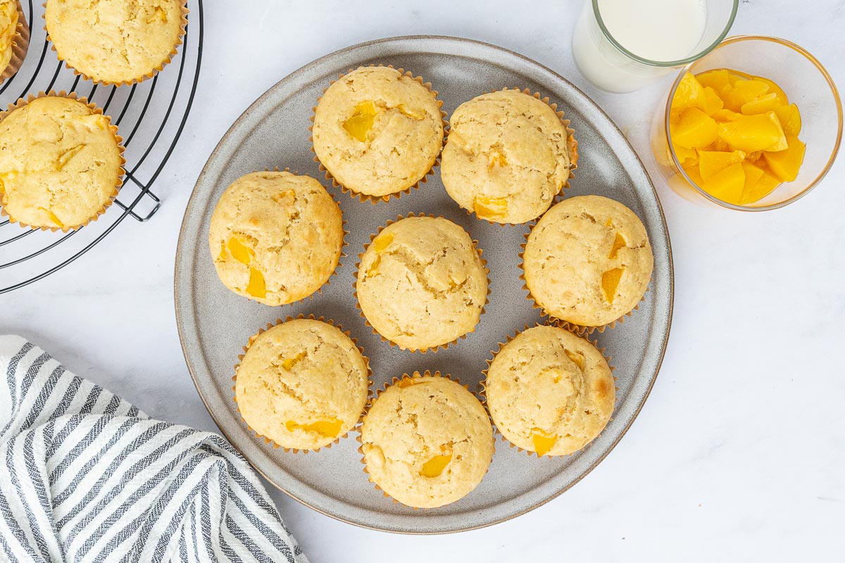 Peach muffins displayed on a serving tray.