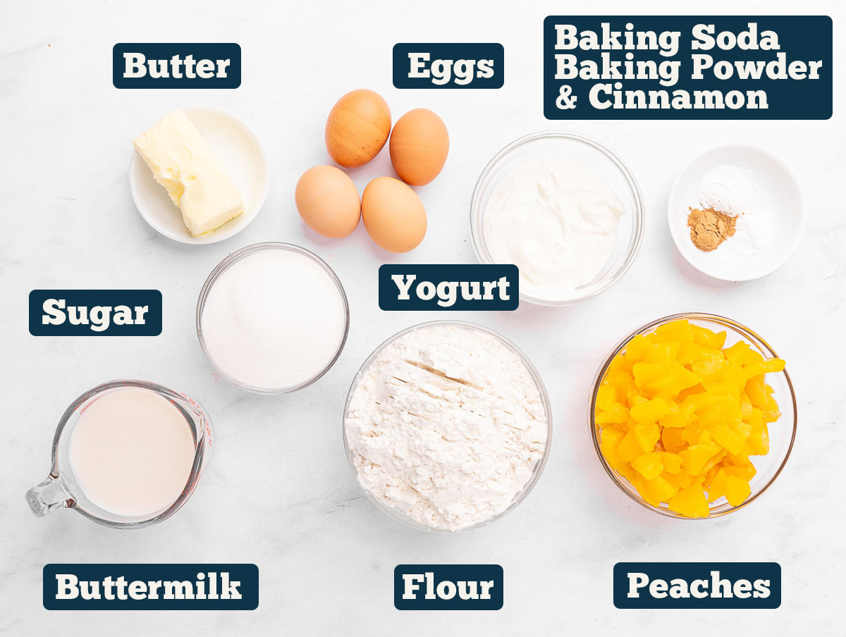 Peach muffin ingredients: flour, sugar, baking soda, baking powder, cinnamon, buttermilk, yogurt, butter, peaches, and eggs.