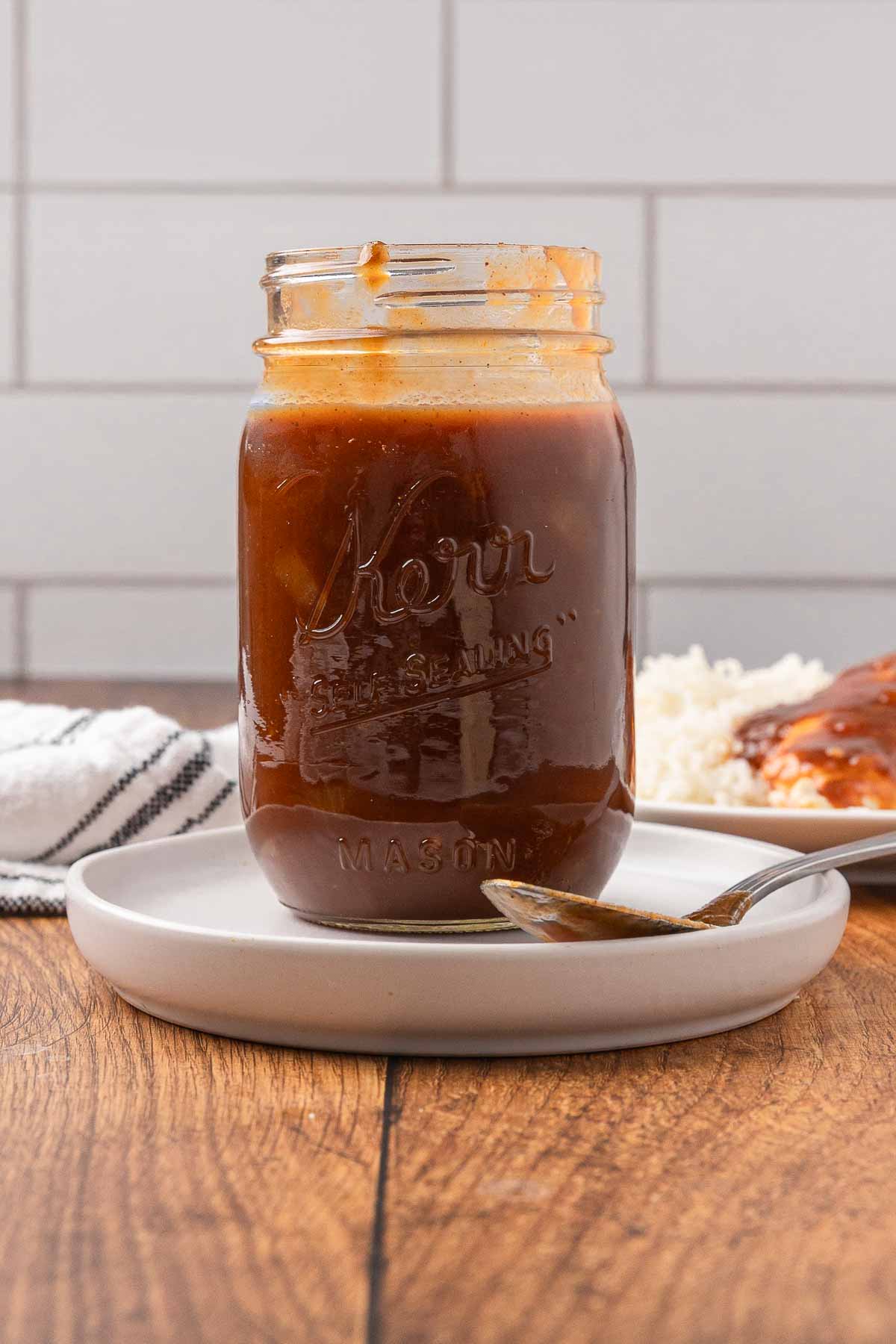 Homemade BBQ sauce in a Mason jar.
