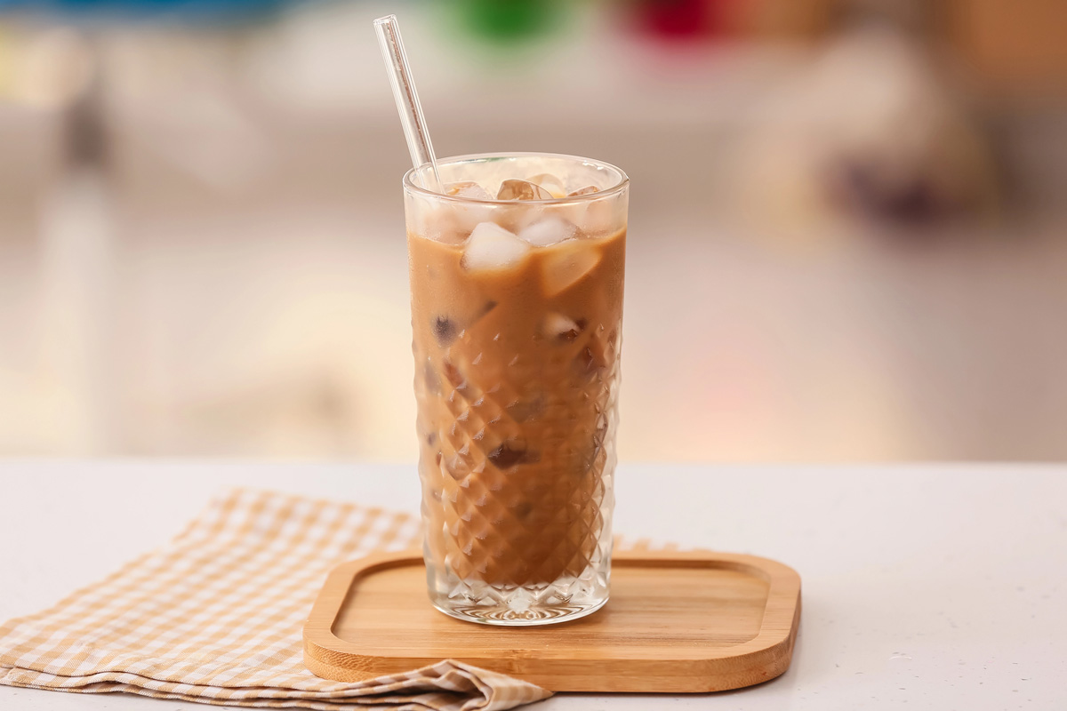 Iced coffee with a straw.
