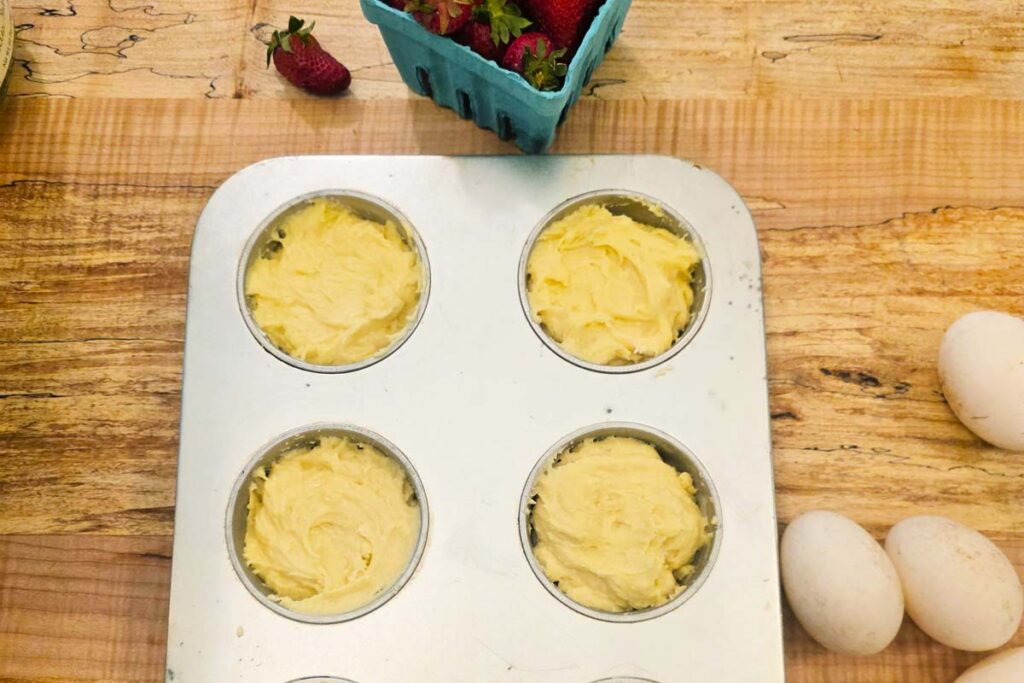 Batter in a large muffin tin.