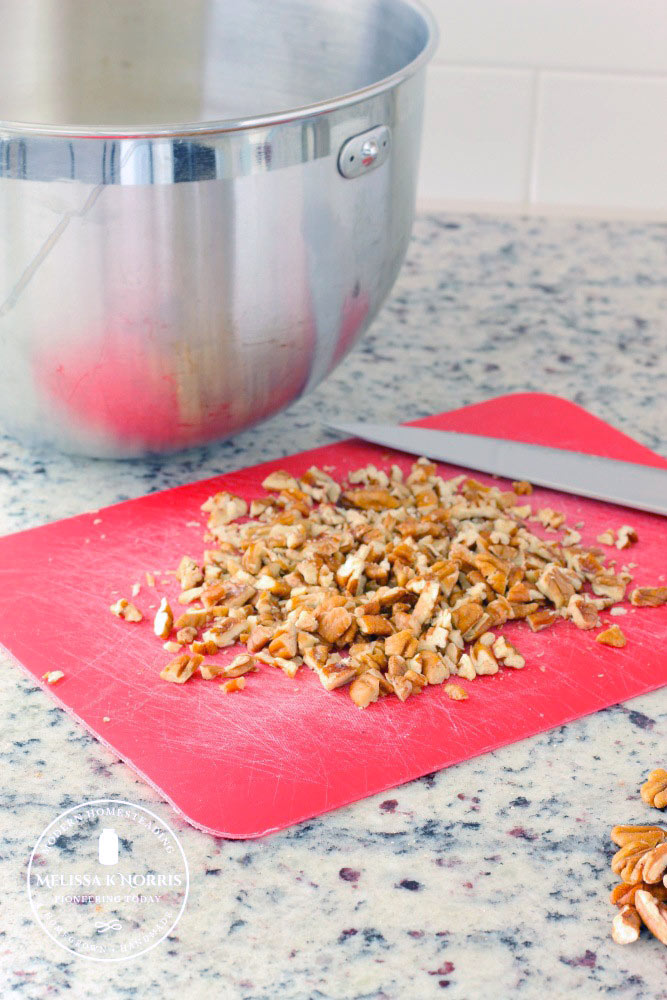 Chopped nuts on a cutting board.