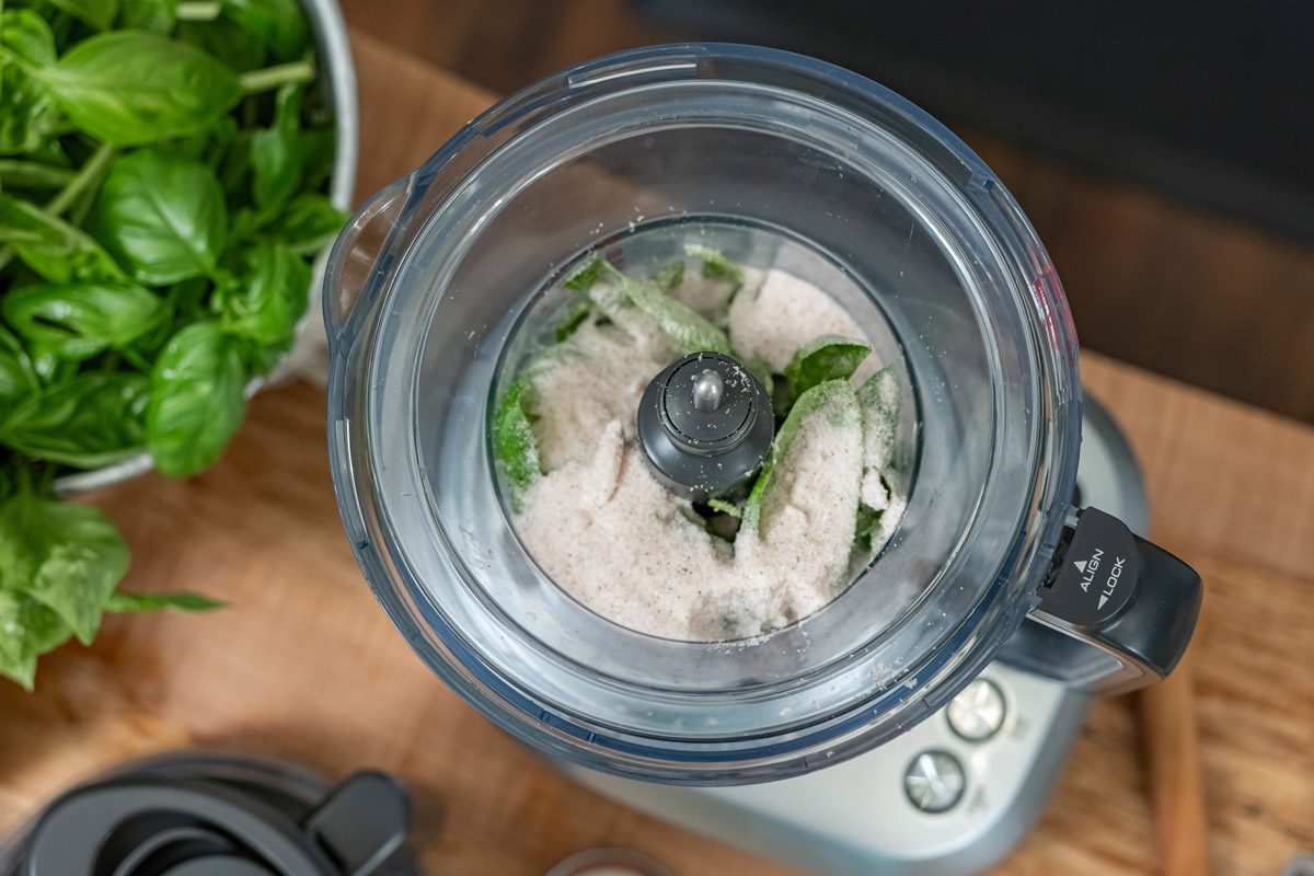 Basil and salt in a food processor.
