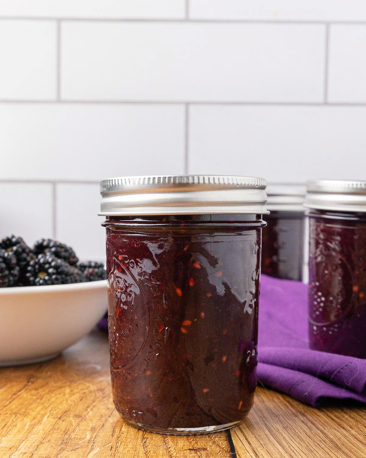 Blackberry jam in a Mason jar.