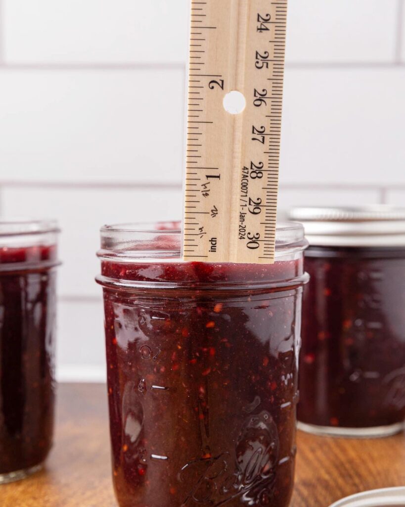Headspace being measured for a jar of blackberry jam.