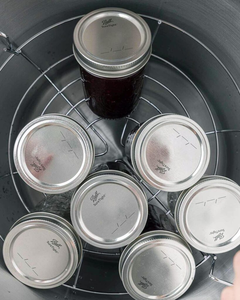 Jars of blackberry jam in a water bath canner.