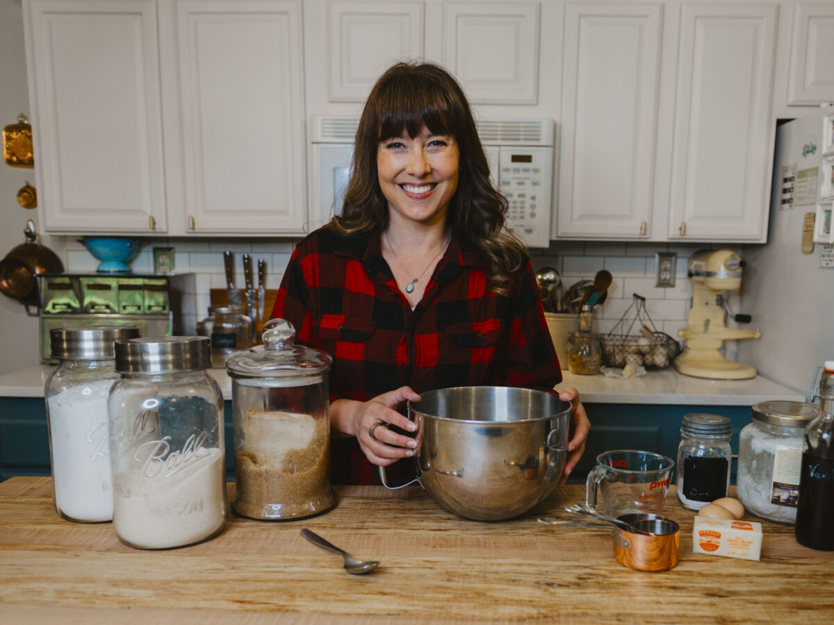 A woman cooking in the kitchen.