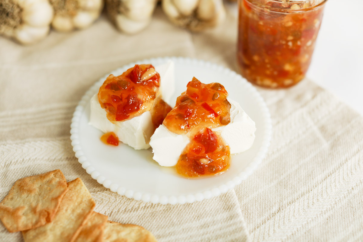 Red pepper jelly over a brick of cream cheese.