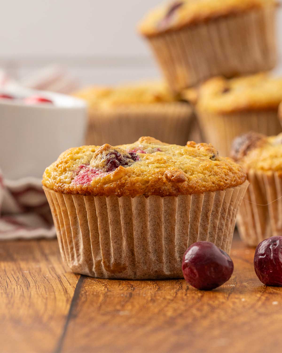 Finished cranberry muffins stacked high.