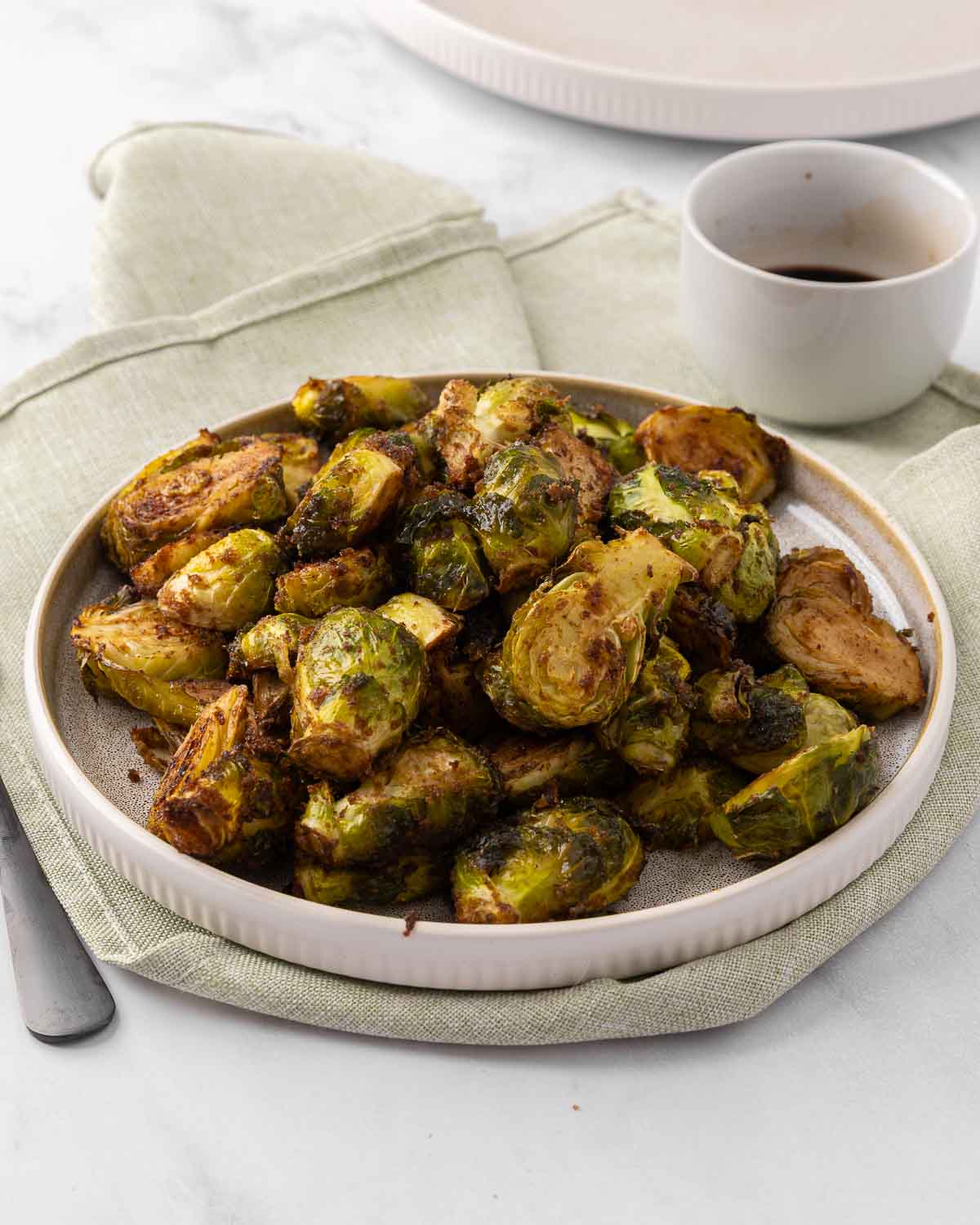 Honey Balsamic Brussel Sprouts on a white plate.