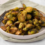 Honey Balsamic Brussel Sprouts on a white plate.