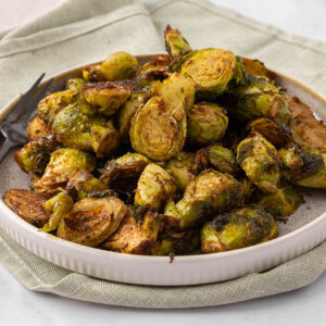 Honey Balsamic Brussel Sprouts on a white plate.