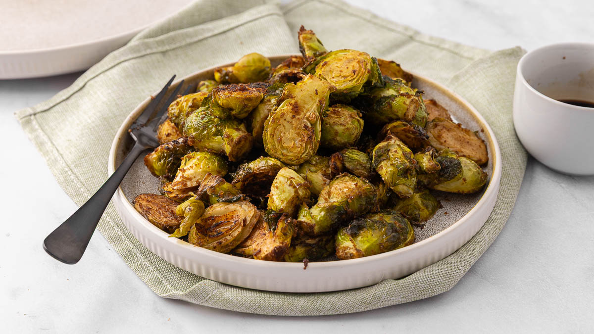 Honey Balsamic Brussel Sprouts on a white plate.