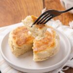 Potato bannock on a white plate, a fork with a bite.