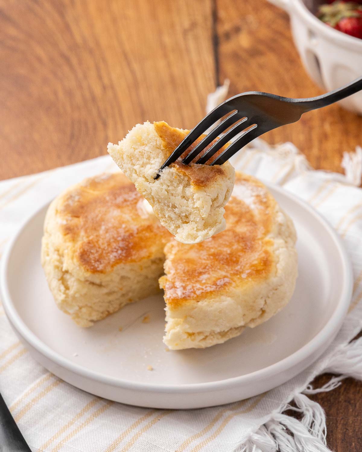 Potato bannock on a white plate, a fork with a bite.