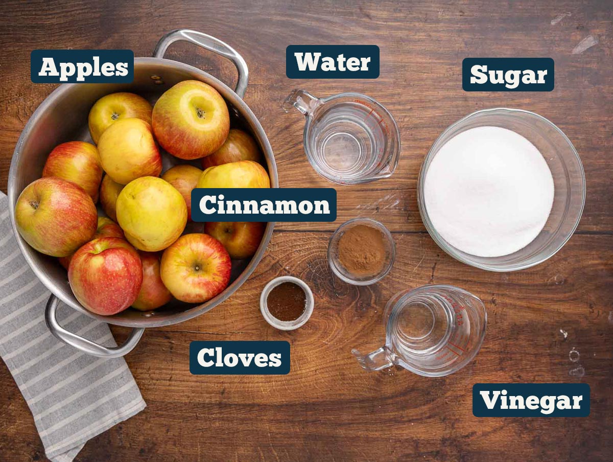 Apple butter ingredients: Apples, water, cinnamon, cloves, sugar, and vinegar.