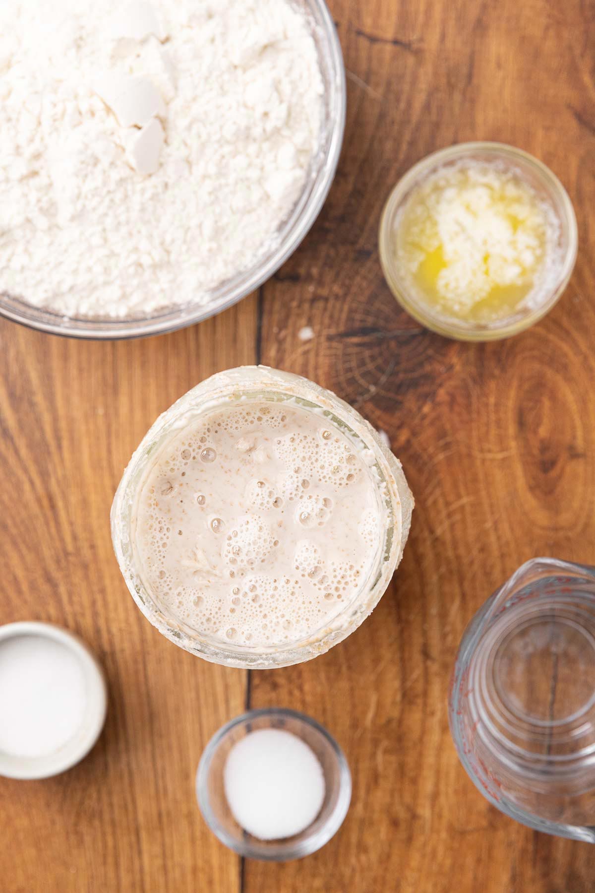 A bubbly sourdough starter in a jar.