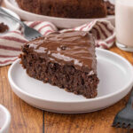 A slice of chocolate beet cake on a white plate.