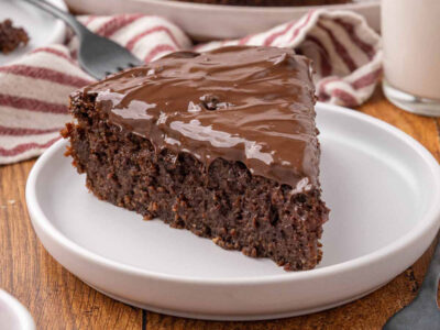 A slice of chocolate beet cake on a white plate.