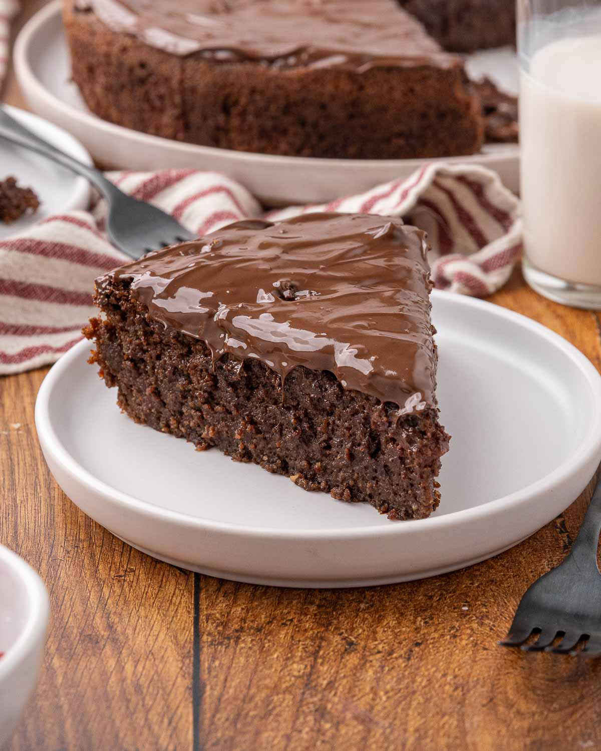 A slice of chocolate beet cake on a white plate.