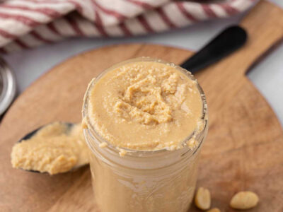 A pint jar full of homemade peanut butter.